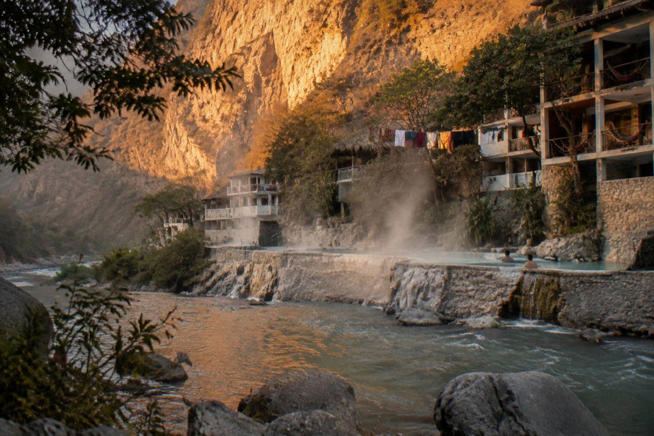 Canyon cliffs glowing in late afternoon light above the river at Tolantongo